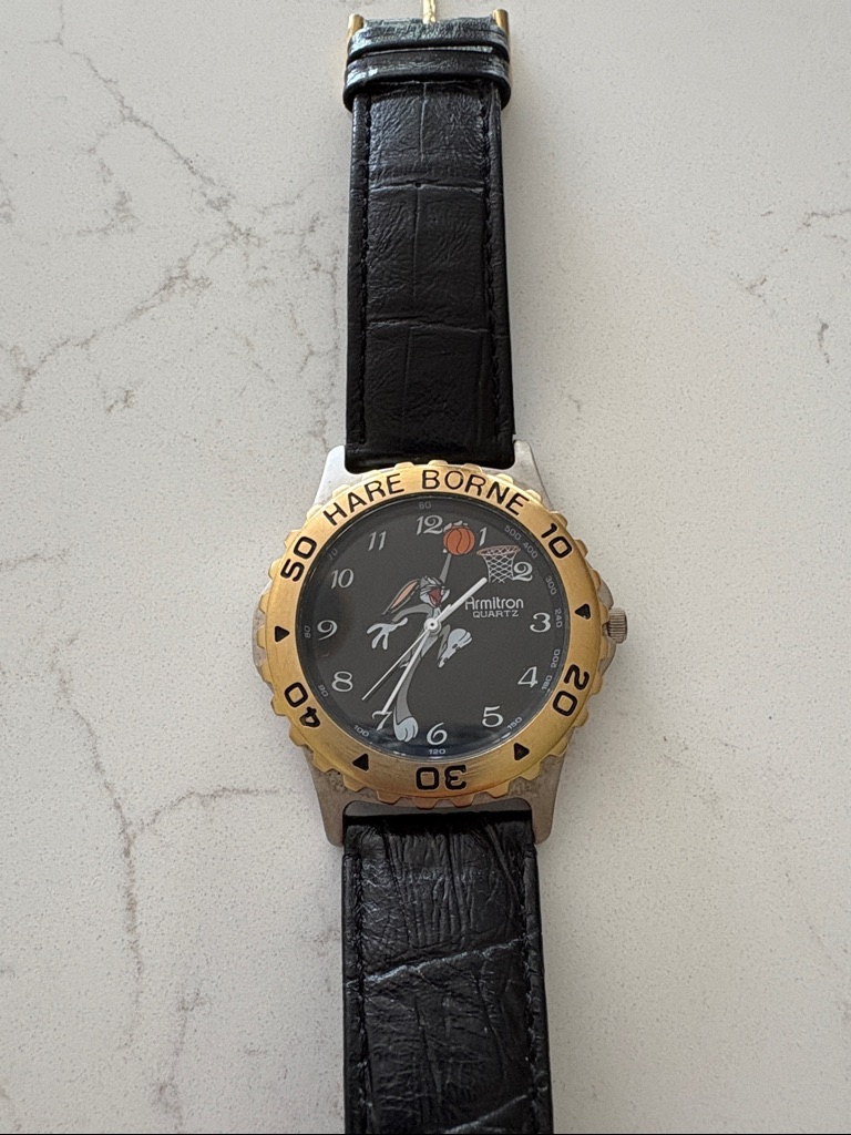 Armitron Black Dial Watch With Gold Bezel And Black Strap